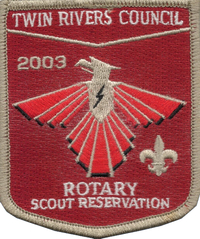 A red patch with a red background and a red and gold phoenix with a thunder bold in the center of its chest.  It says 