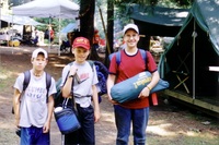 Three scouts smile for the camera.