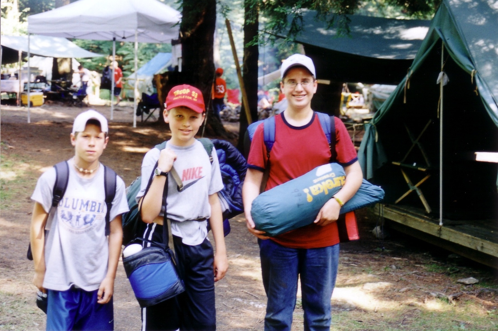Three scouts smile for the camera.
