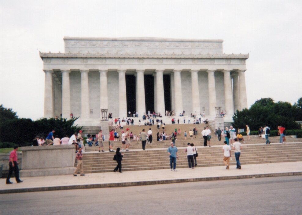 Photo of the Lincoln Memorial from the outside.  Scouts are halfway up walking towards the enterance.