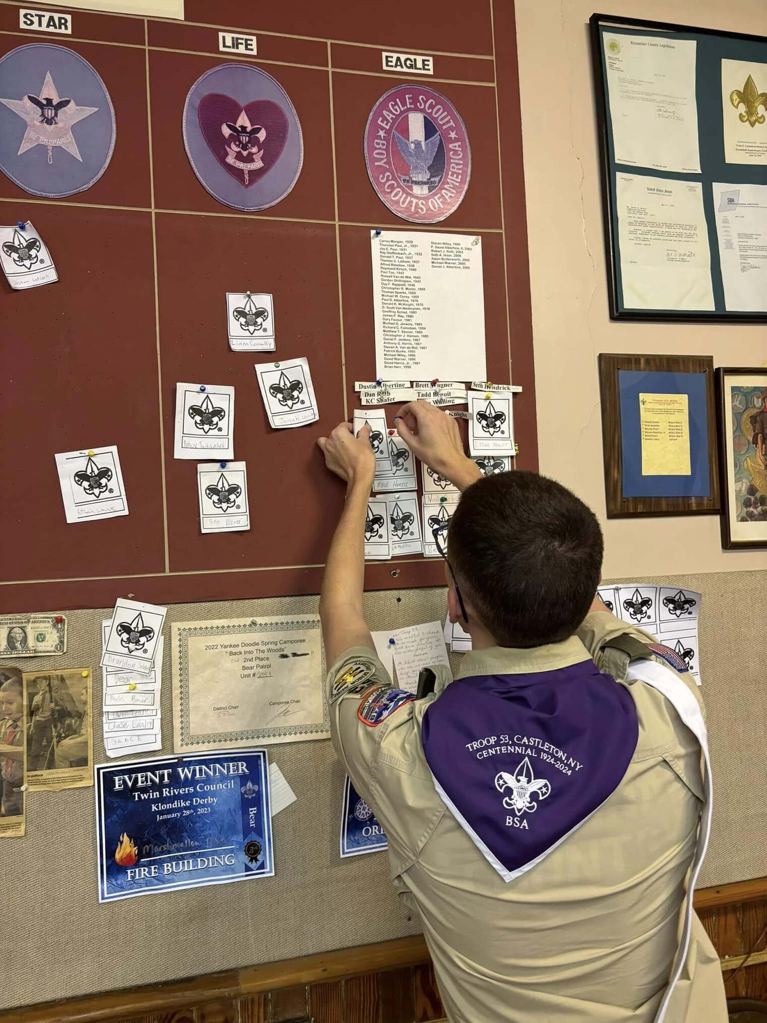 Anthony moves a piece of paper with their name on it under a column that says 