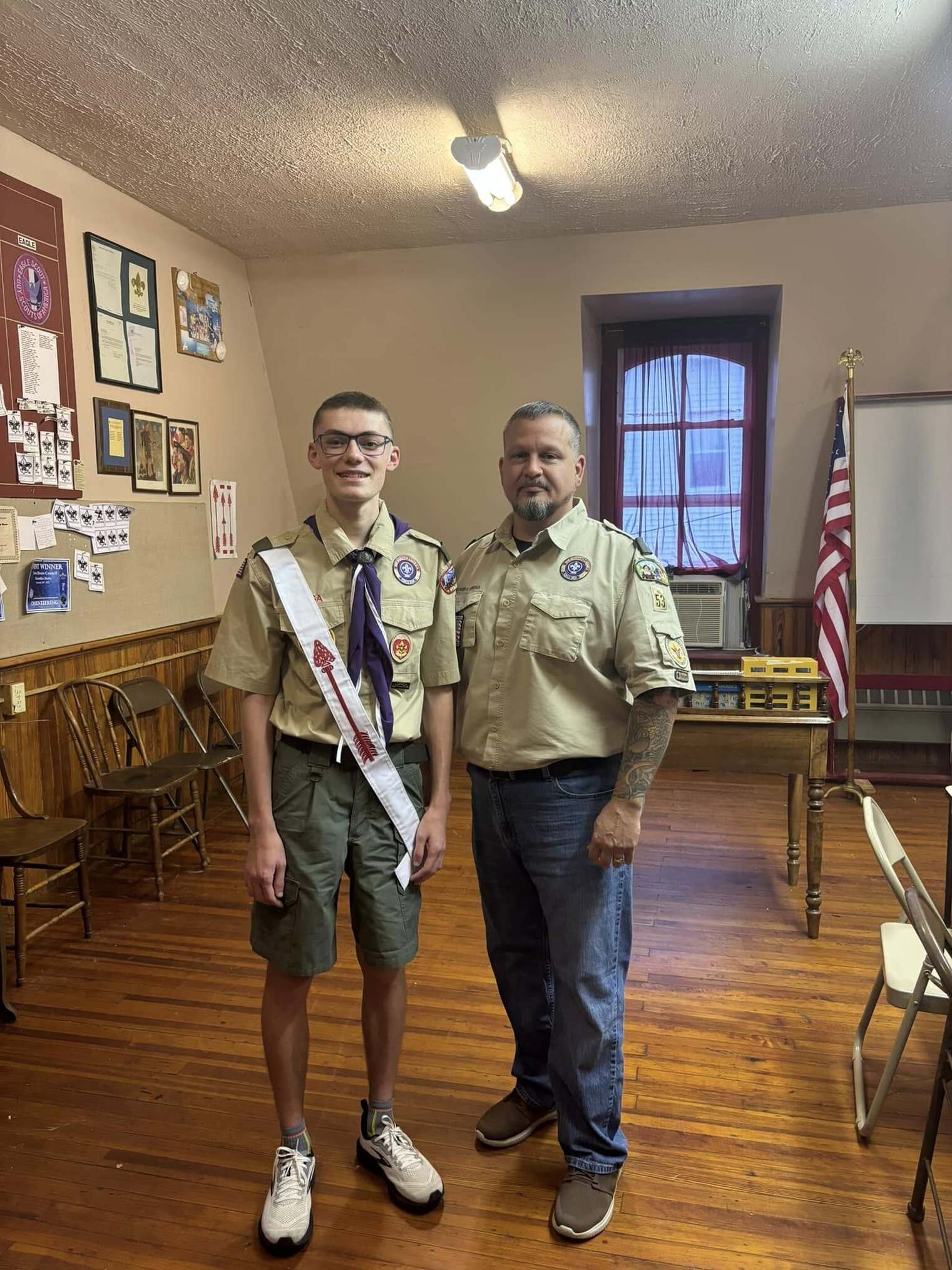 Two people in Class A uniforms.