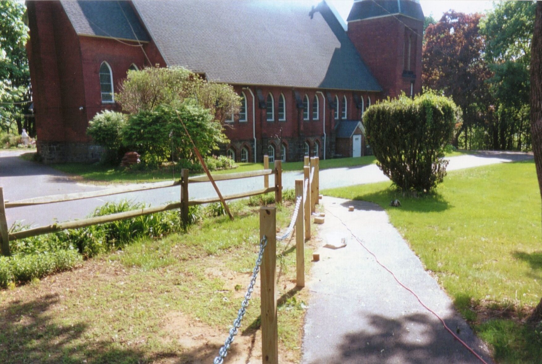 Chain is running between each of the posts.  Tops of the posts have been sawed off so they are the same height.
